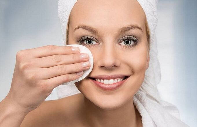 Girl cleans her face